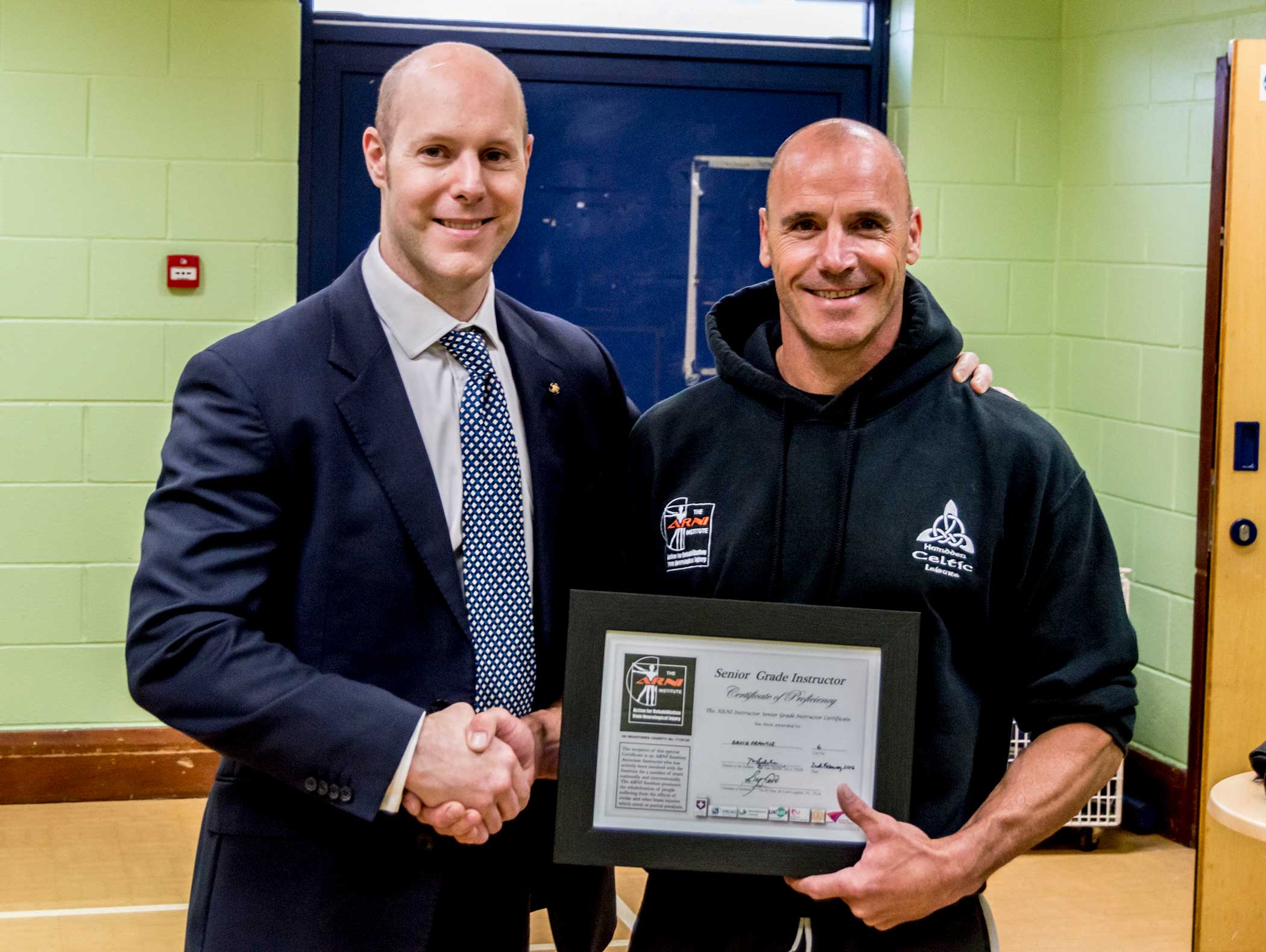 Trainer being presented a certificate in Neath