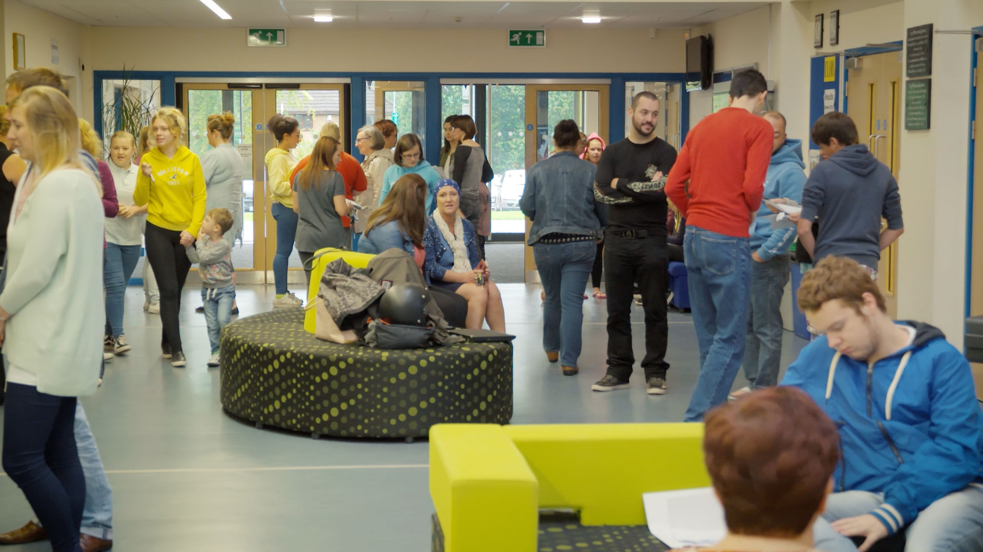 Students being filmed waiting for their GCSE results