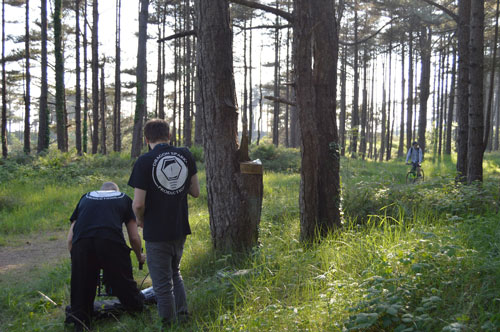Filming a cyclist looking for a geocache in Pembrey