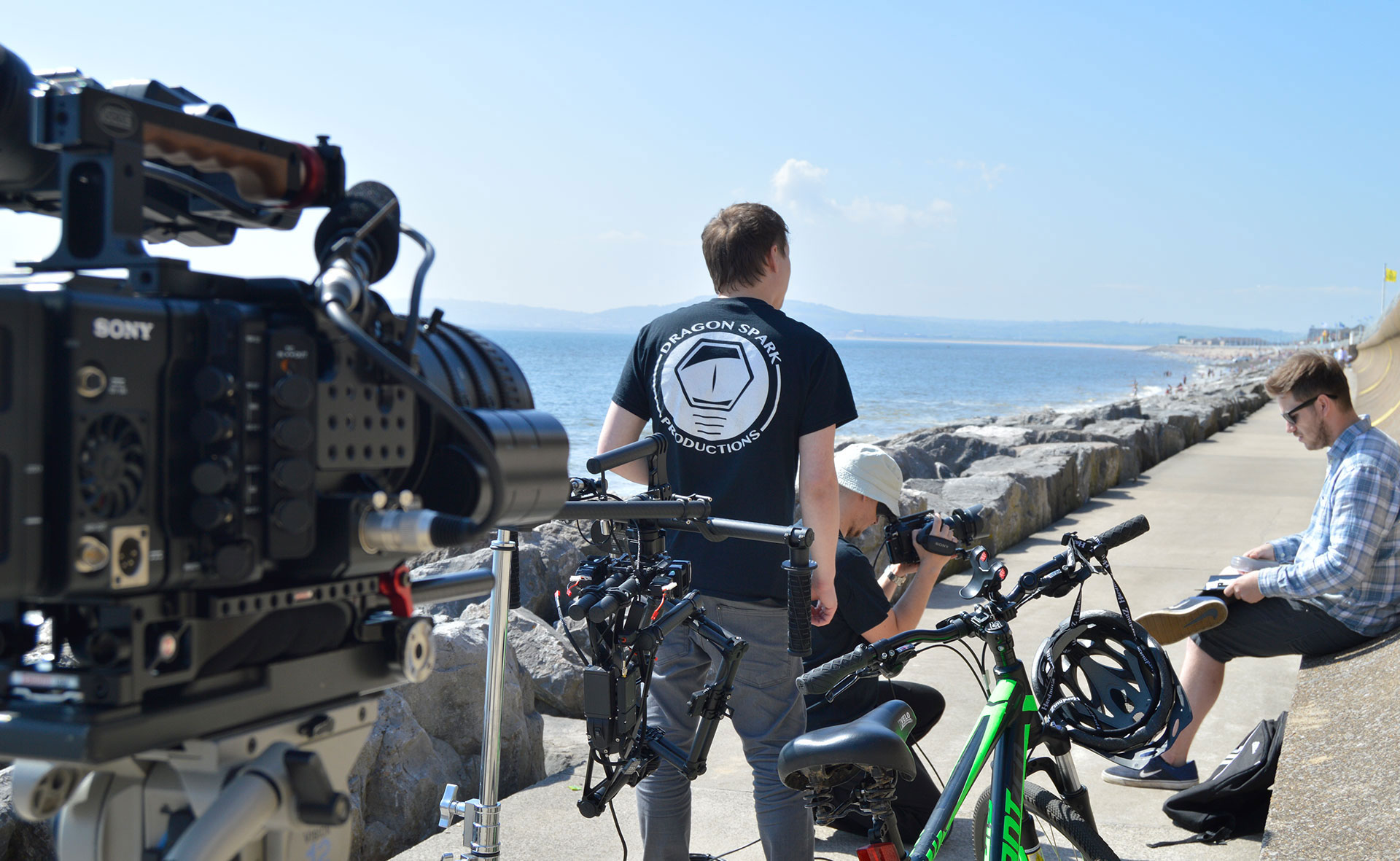 Filming man cycling on Aberavon beach
