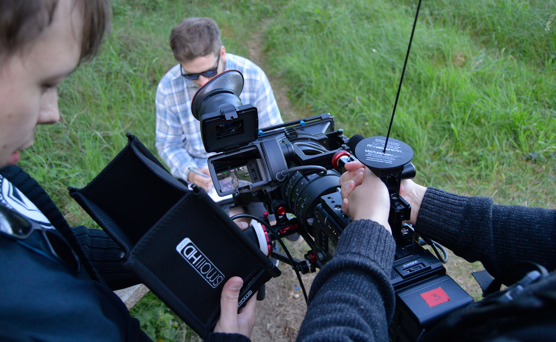Filming an artist outdoors in Pembrey 