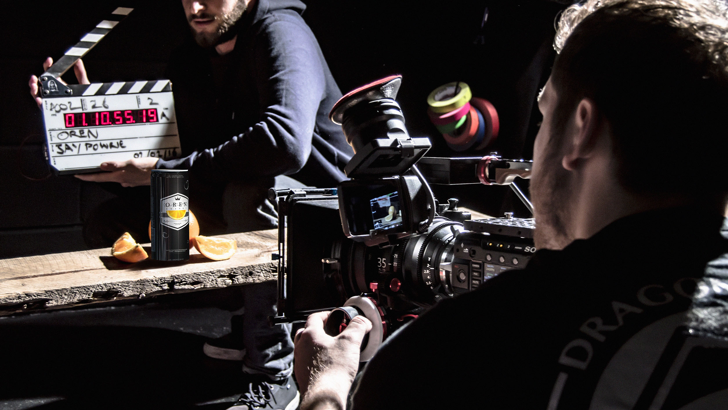 Filming an energy drink with oranges