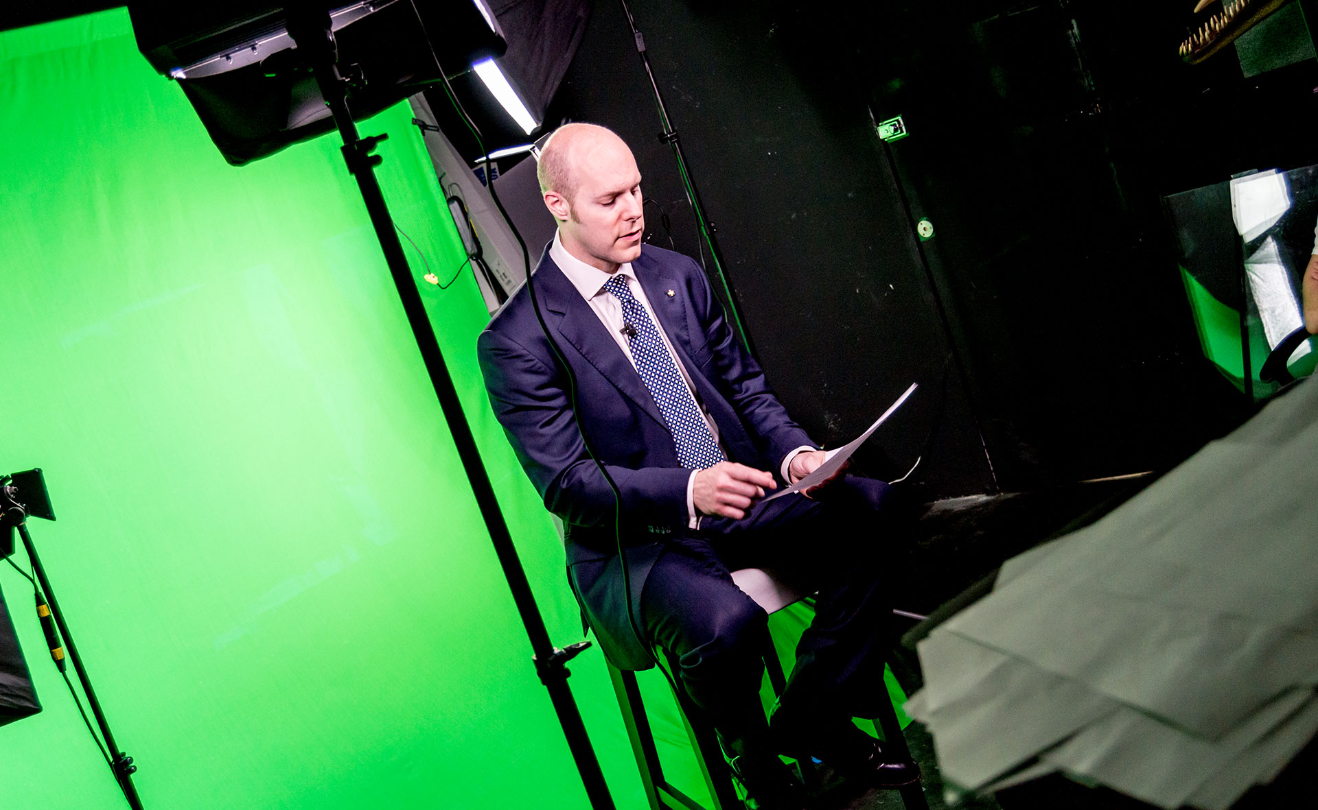 Filming in a studio in front of green screen 