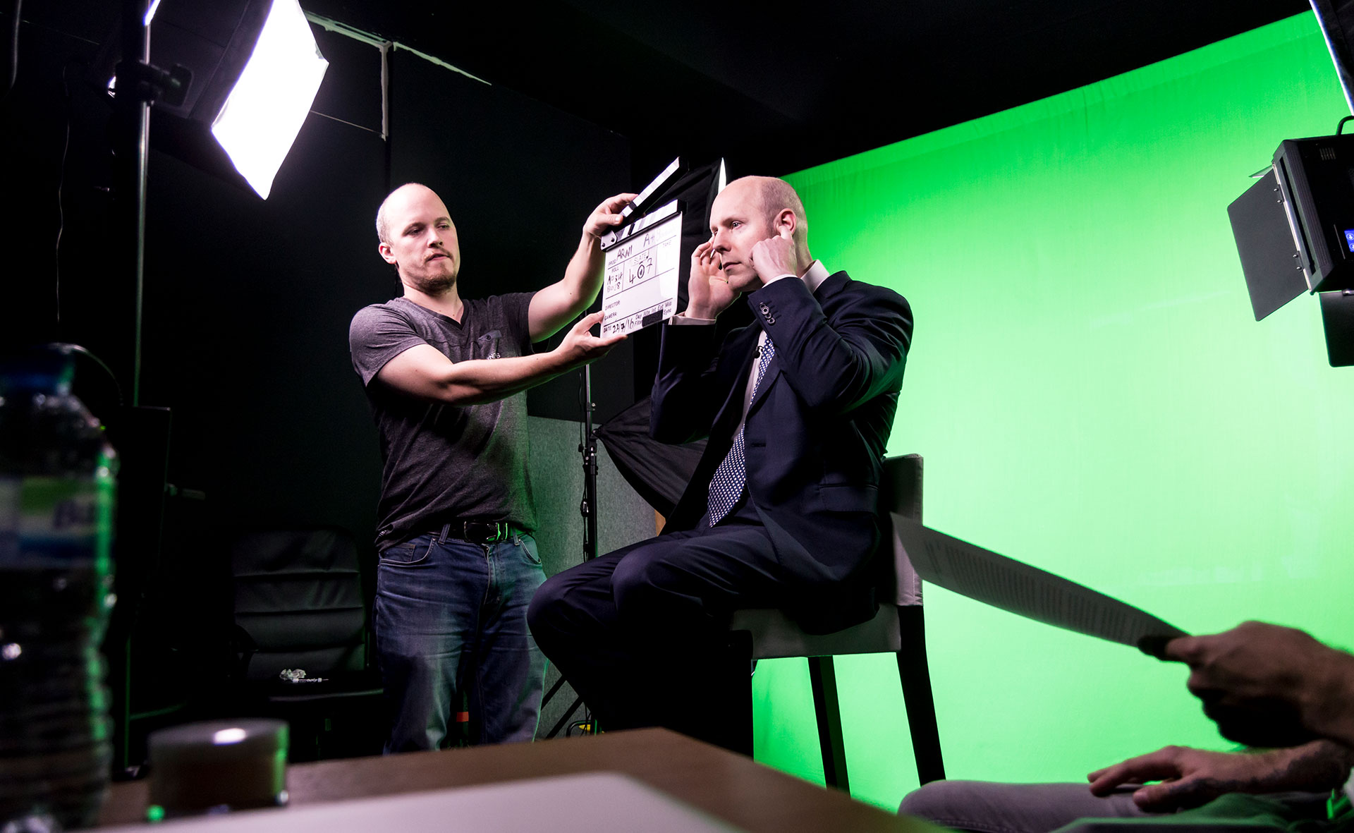 Filming in studio in front of green screen