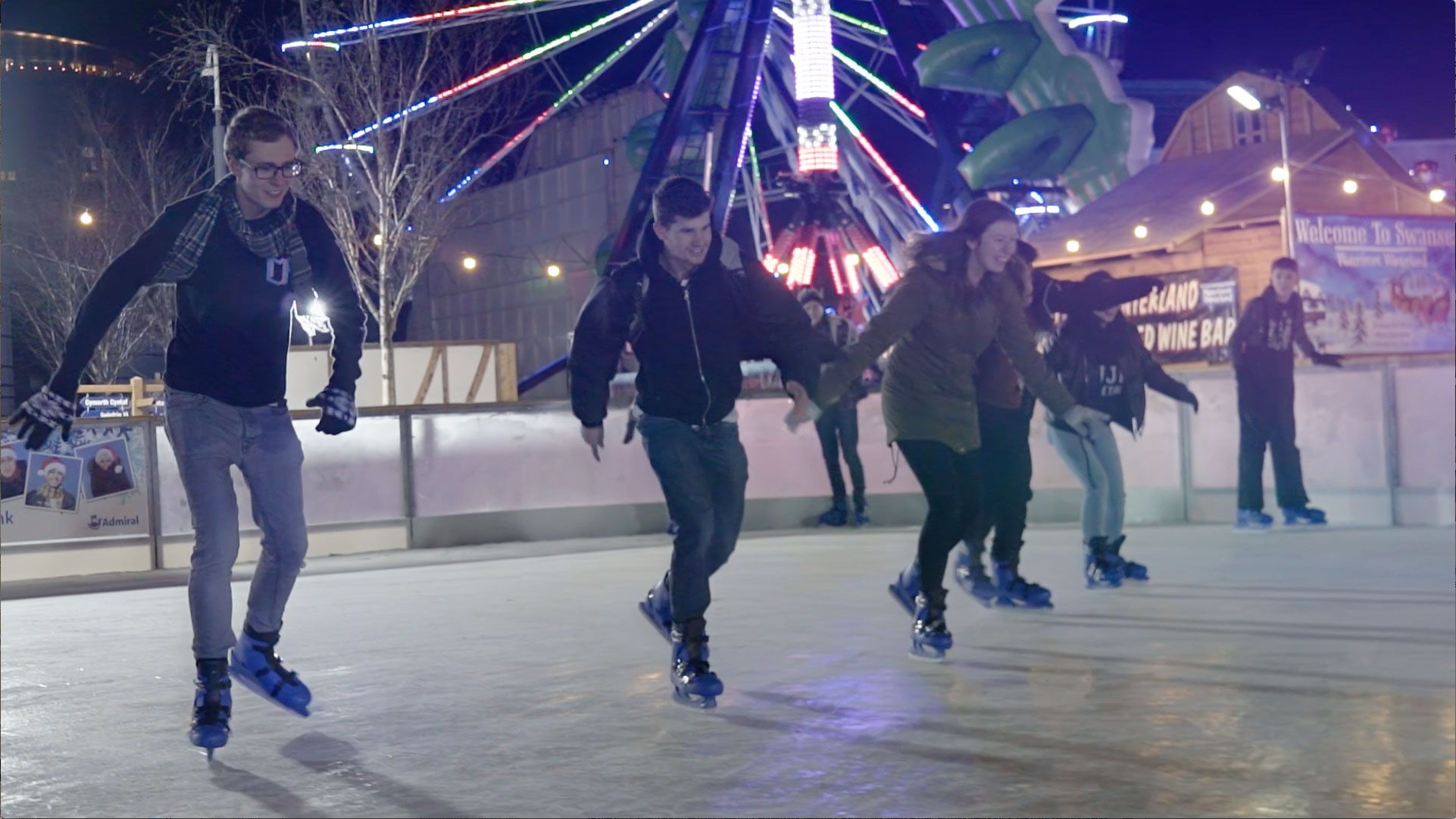 Ice skaters racing on a rink