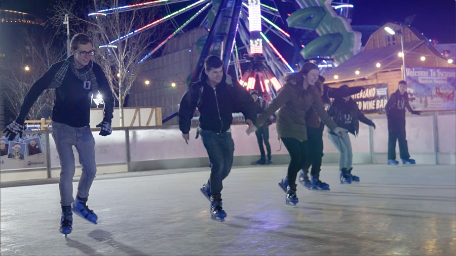 Ice skaters racing on a rink